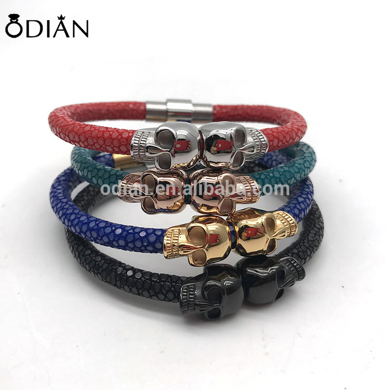 7.5 inches Blue stingray leather cord combine with 18k gold plated stainless steel skull heads bangle skull bracelet